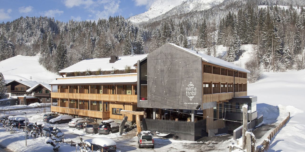 Oversized timber  gives the alpine  hotel a unique profile